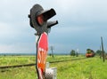 Railroad crossing signs and the approaching train Royalty Free Stock Photo