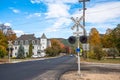 Railroad crosssing with signals in a mountain town on a clear autumn day Royalty Free Stock Photo