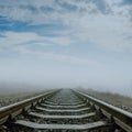 Railroad in fog to horizon Royalty Free Stock Photo