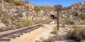 Railroad leads to a tunnel on California desert Royalty Free Stock Photo