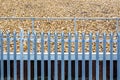 Railroad metal fence over gravel background in england uk Royalty Free Stock Photo