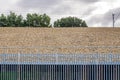 Railroad metal fence over gravel background in england uk