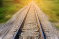 Railroad in motion with sun rays background. Blurred railway. Transportation.