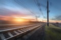 Railroad in motion at sunset. Railway station Royalty Free Stock Photo