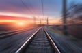 Railroad in motion at sunset. Railway station Royalty Free Stock Photo