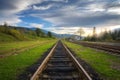 Railroad in mountains at sunset in summer. Industrial landscape Royalty Free Stock Photo