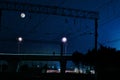 railroad in night under full moon. Beautiful night landscape with bridge over the railroad