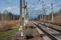 Railroad Rails going into the distance. Pillars, wires, railway arrows Royalty Free Stock Photo