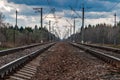 Railroad Rails going into the distance. Pillars, wires, railway arrows Royalty Free Stock Photo