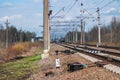 Railroad Rails going into the distance. Pillars, wires, railway arrows Royalty Free Stock Photo