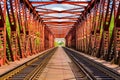 Railroad on a red bridge in summer day Royalty Free Stock Photo