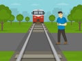 Railroad safety rules and tips. Do not use mobile phone on or near railway tracks . Male texting phone while crossing the railroad