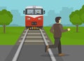 Railroad safety rules and tips. Young male character crossing the railroad tracks while train is approaching.