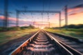 Railroad and sky with clouds at sunset with motion blur effect