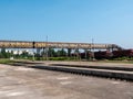 Railroad station. Long iron footbridge across the railroad tracks Royalty Free Stock Photo