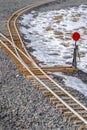 Railroad switch on a railroad junction in winter Royalty Free Stock Photo