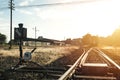 Railroad switch with train in the morning sun Royalty Free Stock Photo