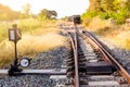 Railroad switch with train in the morning sun. The conception of