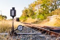 Railroad switch with train in the morning sun. The conception of Royalty Free Stock Photo