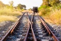 Railroad switch with train in the morning sun. The conception of Royalty Free Stock Photo