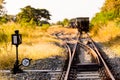 Railroad switch with train in the morning sun. The conception of Royalty Free Stock Photo