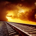 Railroad to orange horizon in sunset