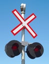 Railroad track x sign crossing intersection road