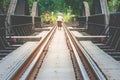 Railroad tracks on The Bridge of River Kwae is historic buildings and landmark of Kancjanaburi Province, Thailand.