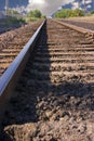 Railroad Tracks with Clouds in the Horizon Royalty Free Stock Photo
