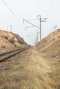 Railroad tracks in the desert under the sky Royalty Free Stock Photo