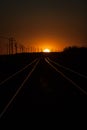 Railroad Tracks Lit During a Golden Summer Sunset Royalty Free Stock Photo