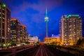 Railroad tracks and modern buildings at night, in downtown Toronto, Ontario. Royalty Free Stock Photo