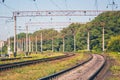 Railroad tracks of modern electrified railways near the forest_