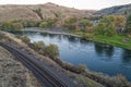 Railroad tracks run along the bank of the Deschutes River at Maupin, Oregon, USA Royalty Free Stock Photo