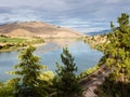 Railroad tracks running along Flathead river in Montana, USA Royalty Free Stock Photo