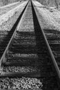 Black and White Image of Railroad Tracks in the Mountains Royalty Free Stock Photo