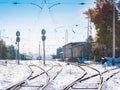 Railroad tracks running to the small snowbound station. Winter