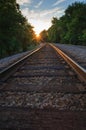 Railroad Tracks At Sunset.