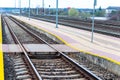 Railroad tracks urban shoot. Leading line view.iron rusty train railway over dark stones rail way Royalty Free Stock Photo