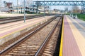 Railroad tracks urban shoot. Leading line view.iron rusty train railway over dark stones rail way Royalty Free Stock Photo