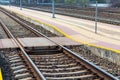 Railroad tracks urban shoot. Leading line view.iron rusty train railway over dark stones rail way Royalty Free Stock Photo