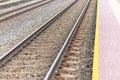 Railroad tracks urban shoot. Leading line view.iron rusty train railway over dark stones rail way Royalty Free Stock Photo