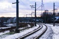 Railroad tracks in a winter foggy morning sprinkled with snow Royalty Free Stock Photo