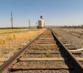 Railroad tracts lead to granary to collect grain for transport