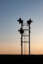 Railroad Traffic Signals Silhouetted Against Prairie Sunrise Sky Royalty Free Stock Photo