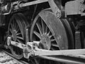 Railroad train steam engine drive wheels in black and white