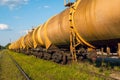 Railroad train of tanker cars transporting crude oil on the tracks Royalty Free Stock Photo