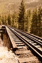 Railroad train tracks through countryside Royalty Free Stock Photo