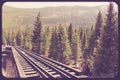 Railroad train tracks through countryside Royalty Free Stock Photo