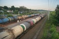 Railroad transportation, tourism travel. Evening Railway platform and station. Industrial concept, cargo freight train background Royalty Free Stock Photo